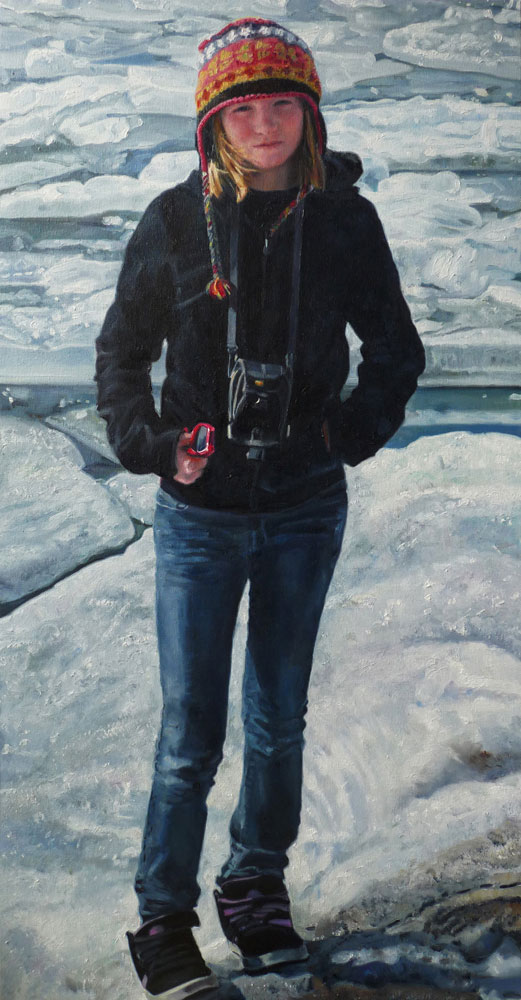 Portrait of Alex with camera and sunglasses.