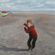 Portrait of a boy with kite.